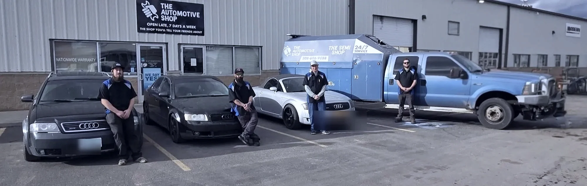 The Automotive Shop crew in uniform out front with customer Audis in Jerome, Idaho